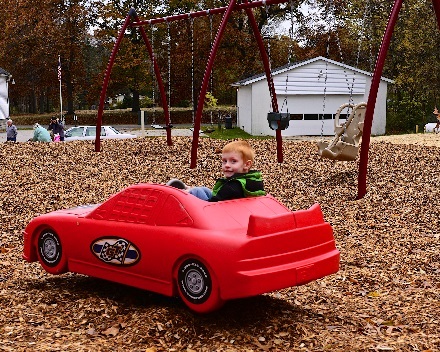Boy in toy car